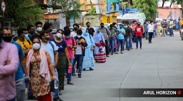 Huge number of beneficiaries line up for their first dose of Covid vaccine at Oyster and Pearl Hospital in Shivajinagar,  Pune. (Express Photo)