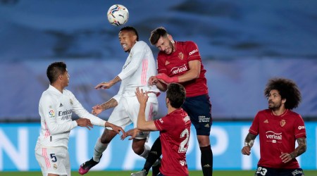 Real Madrid's Eder Militao jumps for the ball with Osasuna's David Garcia during the Spanish La Liga soccer match between Real Madrid and Osasuna at the Alfredo di Stefano stadium in Madrid (Source: AP)