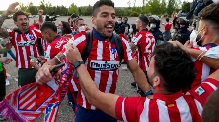 Atletico Madrid's Luis Suarez celebrates with supporters after the Spanish La Liga soccer match between Atletico Madrid and Valladolid at the Jose Zorrilla stadium in Valladolid, Spain, Saturday, May 22, 2021. Atletico won 2-1 and clinches its 11th Spanish La Liga title. (Source: AP)