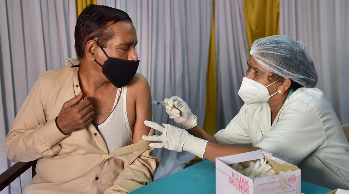 A health worker administers a dose of Covid-19 vaccine to a beneficiary at a vaccination centre in Bengaluru, Friday, May 28, 2021. (PTI Photo/Shailendra Bhojak)