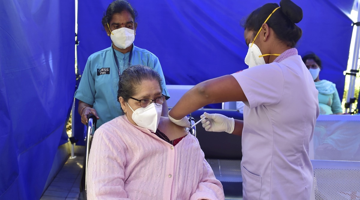 A health worker administers a dose of the 'Covaxin' Covid-19 vaccine at a private hospital in Bengaluru. (Photo: PTI)