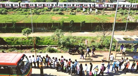 Commuters make a long B-line to commute in buses to work at Maharashtra Nagar Bus stop in Mankhurd area; as a part of restrictions general public still not allowed to commute by Mumbai local railways resulting in long wait to board the bus.
(Express Photo by Amit Chakravarty)