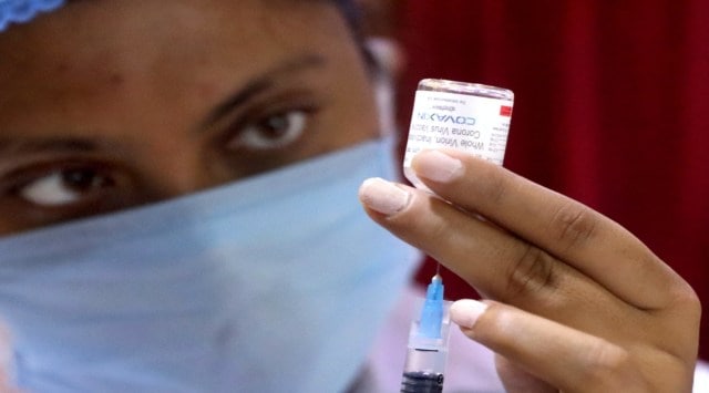 A health worker prepares to administer a dose of Covaxin in Kolkata on Wednesday. (Express photo by Partha Paul)