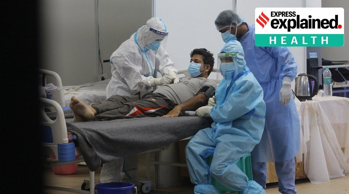 Covid-19 patients are treated at a care centre in New Delhi. (Express Photo: Amit Mehra)