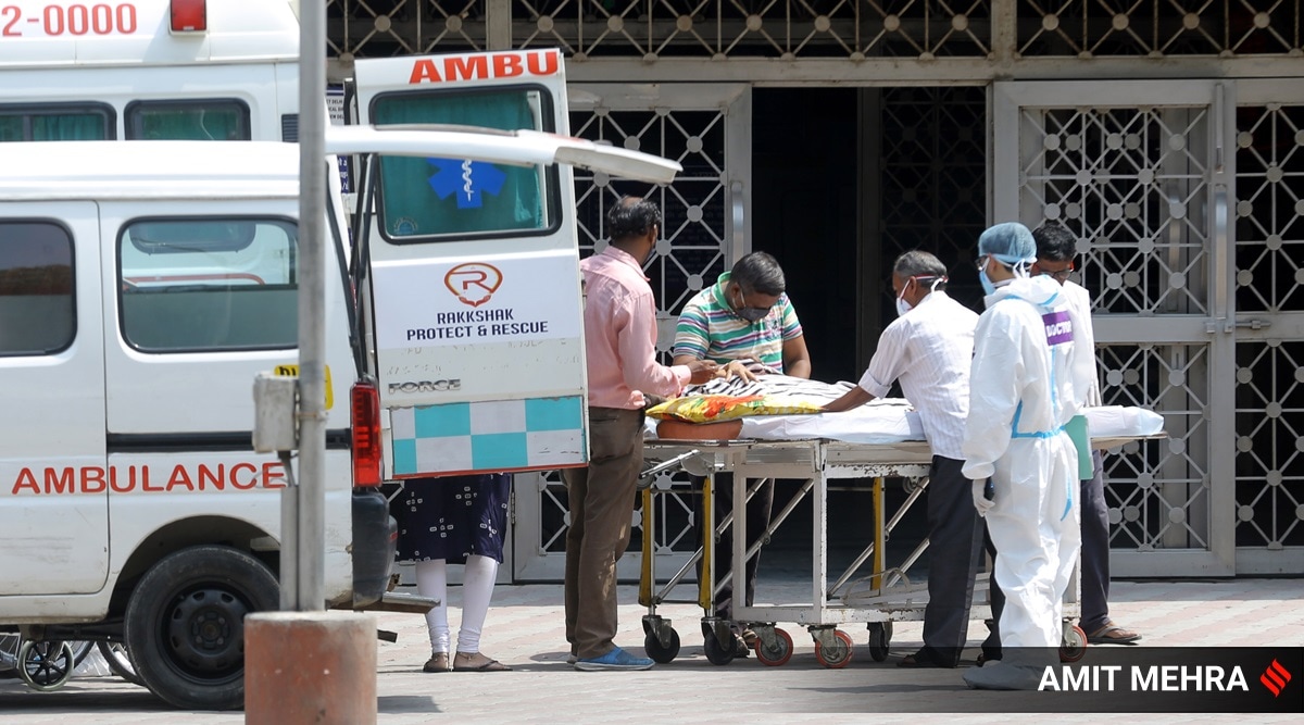 A Covid-19 patient waits to be admitted at LNJP hospital for treatment, in New Delhi on June 14, 2021. (Express Photo: Amit Mehra)