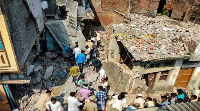 Police and locals carry out relief works after collapse of a two-storeyed house following a cylinder blast, in Tikri village of Gonda district, Wednesday, June 2, 2021. (PTI Photo) 