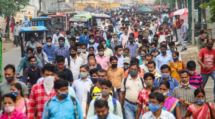 Factory workers wearing masks on their way to work places after unlock process in the ongoing Covid-19 lockdown begins, at Dundahera-Kapashera Delhi border, in Gurugram, Wednesday, June 02, 2021. (PTI)