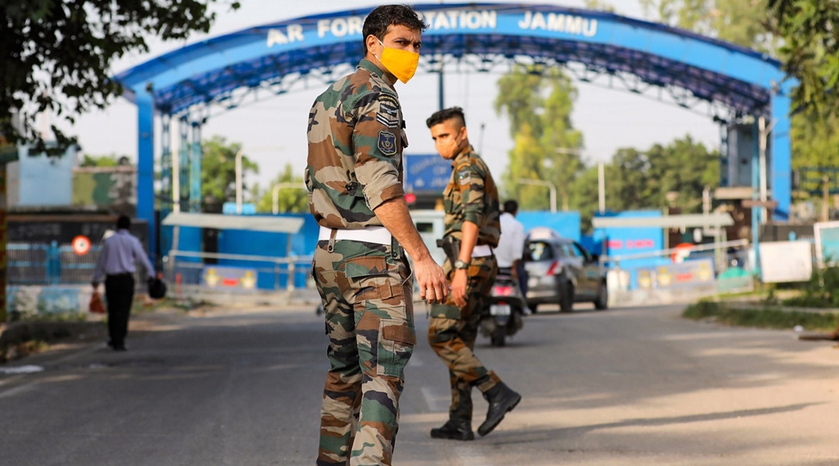 Security personnel stand guard outside Jammu airport on Sunday. (PTI)