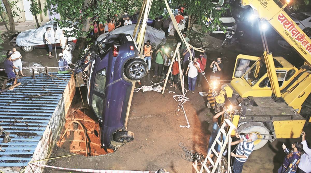 Mumbai: Car sinks into well as parking lot portion caves in | Mumbai News