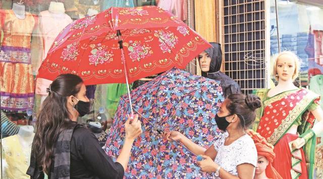 At a shop selling umbrellas in Thane on Friday. (Express Photo by Deepak Joshi)