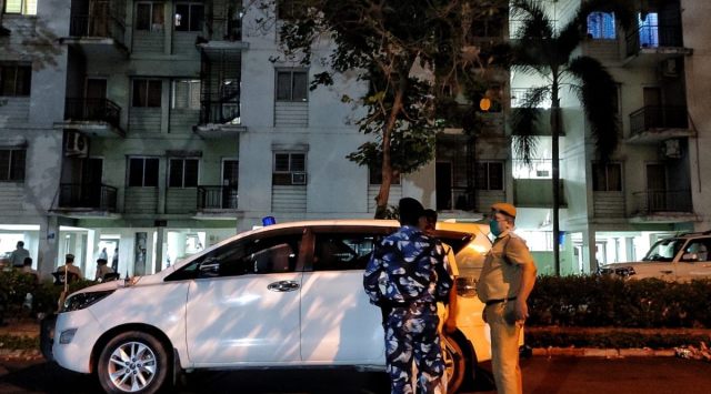 Police outside the Shapoorji Housing Complex where the encounter took place. (Express Photo by Partha Paul)