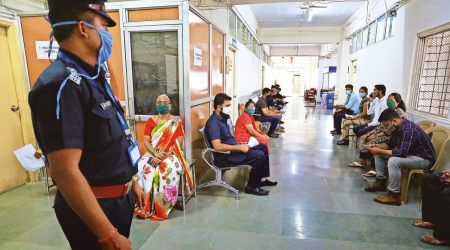 Beneficiaries wait for their turn outside vaccination room at the NMMC hospital in Navi Mumbai of Saturday.
(Express Photo by Amit Chakravarty)