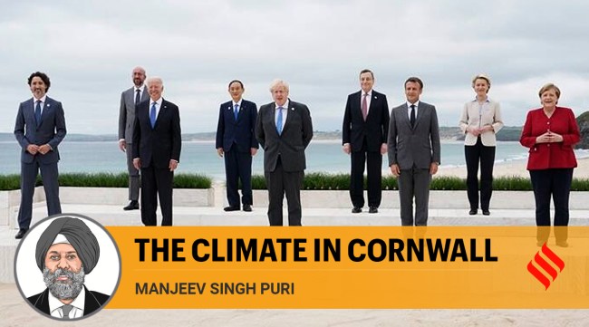 Leaders of the G7 pose for a group photo on overlooking the beach at the Carbis Bay Hotel in Carbis Bay, St. Ives, Cornwall, England, Friday, June 11, 2021. (AP Photo/Patrick Semansky, Pool)