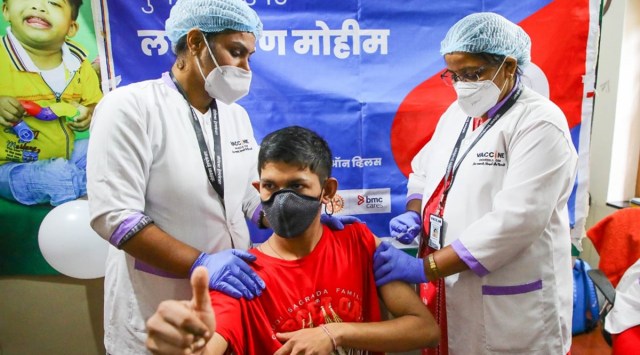 A specially abled kid gets vaccinated in Pune on Thursday. (Express Photo: Ashish Kale)
