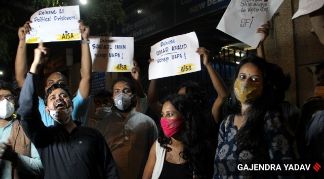 Student activists Natasha Narwal, Devangana Kalita and Asif Iqbal Tanha outside Tihar prison in New Delhi on Thursday (Express Photo: Gajendra Yadav)