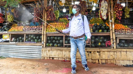 A worker carries out sanitisation in a market area, as part of Covid safety measures, in Agartala, Tripura. (Photo: PTI)