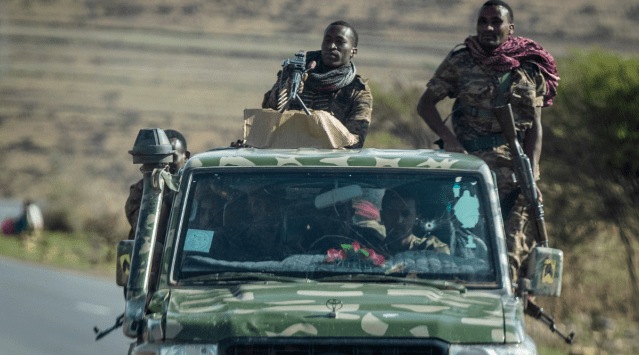 In this Saturday, May 8, 2021 file photo, Ethiopian government soldiers ride in the back of a truck on a road near Agula, north of Mekele, in the Tigray region of northern Ethiopia. (AP)