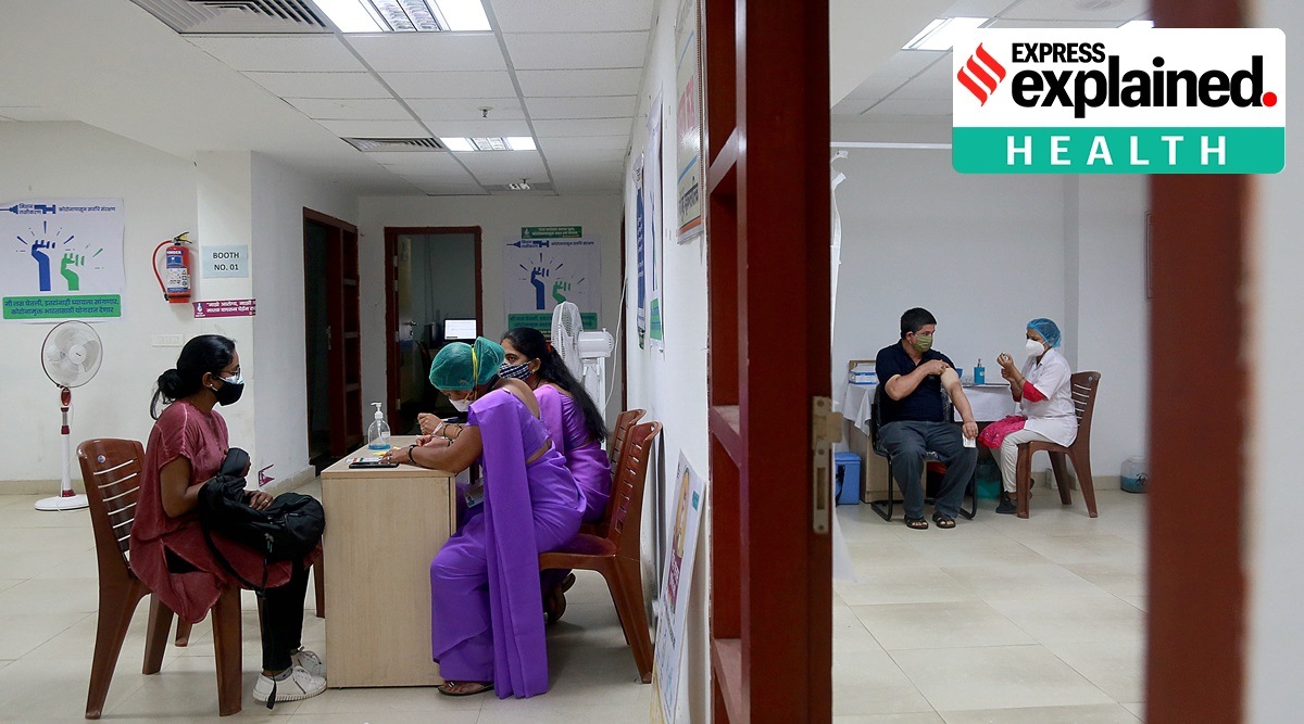Beneficiaries are vaccinated against Covid-19 in Vashi. (Express Photo: Amit Chakravarty)