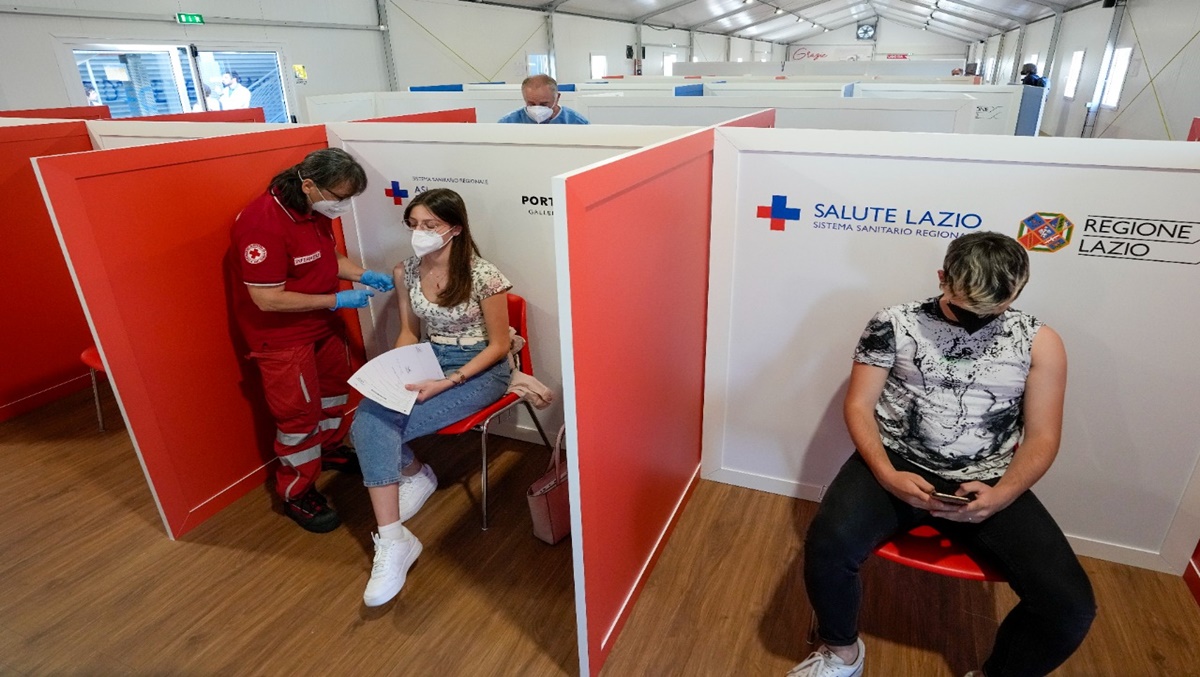 A student is administered her first dose of Pfizer/BioNTech Covid-19 vaccine, at a vaccination hub in a shopping mall in the outskirts of Rome, Tuesday, June 1, 2021. (AP)