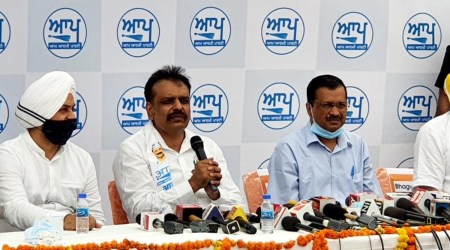 Delhi CM Arvind Kejriwal with ex-IPS officer, Kunwar Vijay Partap, at a press conference in Amritsar. (Photo by Rana Simranjeet)