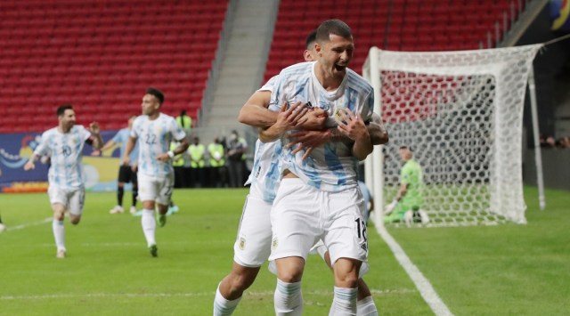 Argentina's Guido Rodriguez celebrates scoring their first goal with Cristian Romero (Source: Reuters)