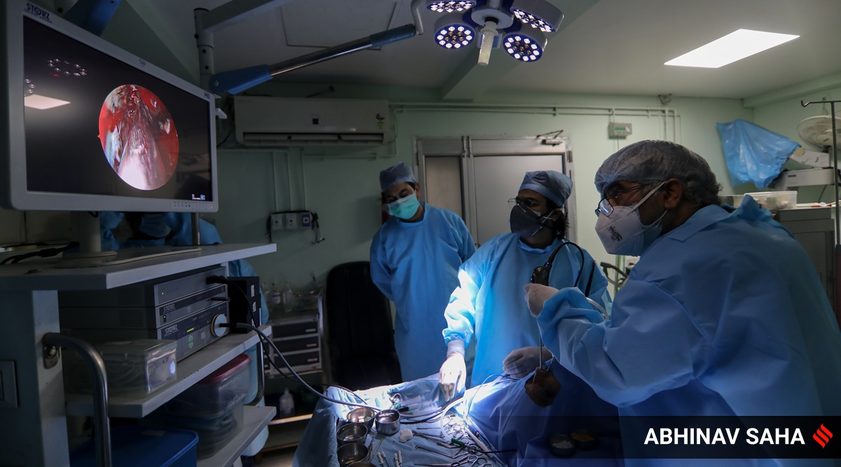 An ENT surgeon conducts surgery of a patient suffering from both white and black fungus. (Express photo by Abhinav Saha)