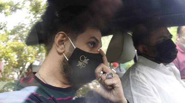 Chirag Paswan waits outside uncle Pashupati Kumar paras’s house in New Delhi Monday. He spent around half-an-hour in his vehicle before being let in. (Express photo by Anil Sharma)