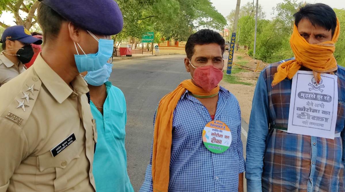 Indien: Nicht geimpfte tragen Plakate mit Totenkopfzeichen! (Video)