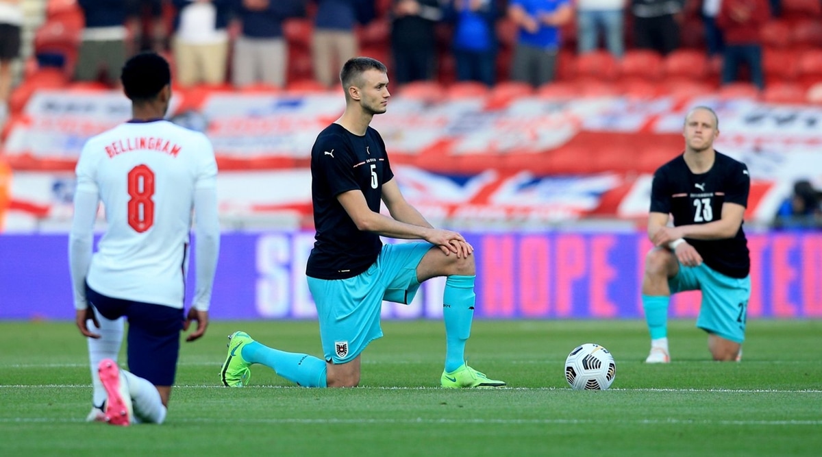 England and Austria players take a knee before a friendly. (Twitter/England)