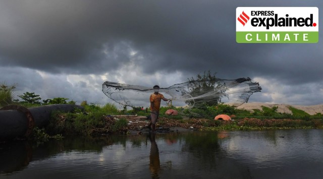 A fisherman casts his net as dark clouds hover in the sky after the southwest monsoon made its footfall in Kerala, in Kochi. (PTI Photo)