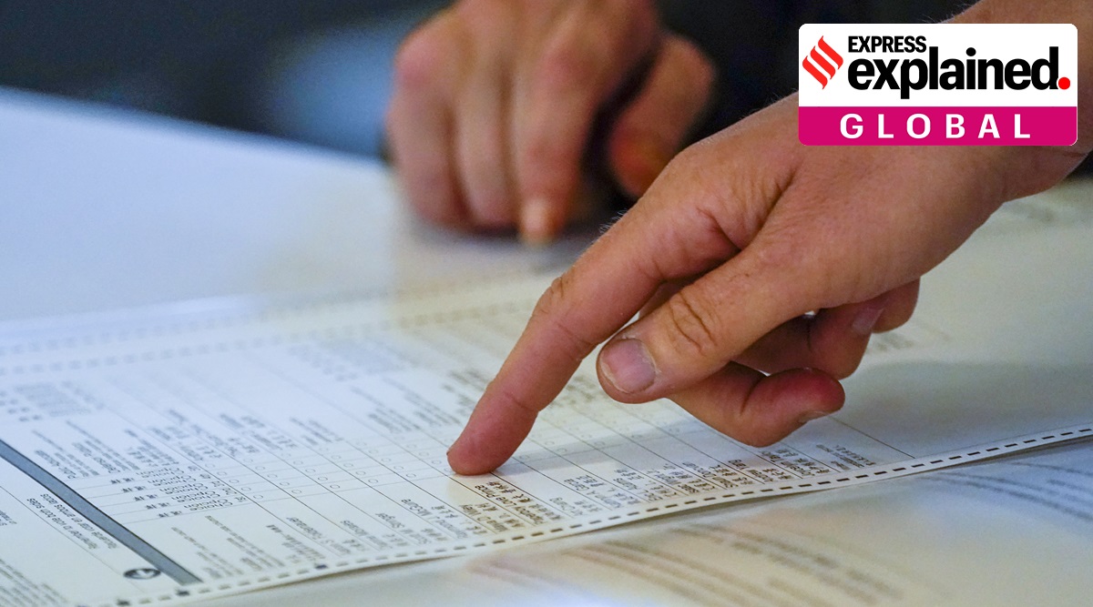 An election worker answers questions on a ranked choice voting ballot during early voting in the primary election, Monday, June 14, 2021. (AP Photo: Mary Altaffer)