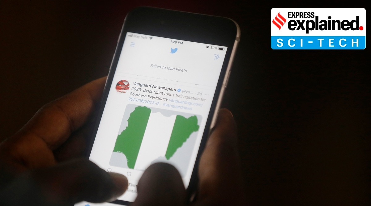 A man reads headline news on Twitter in Lagos, Nigeria, Monday June 7, 2021. (AP Photo: Sunday Alamba, File)