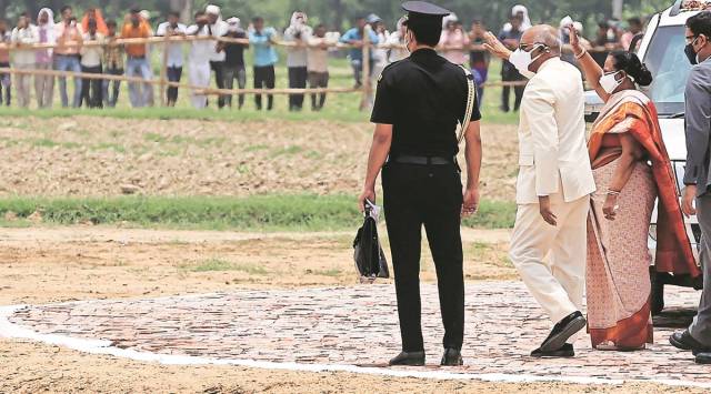 President Ram Nath Kovind with his wife after landing at a helipad near his birthplace, Paraunkh village in Uttar Pradesh’s Kanpur Dehat district. (Express photo by Vishal Srivastav)