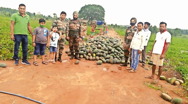Army personnel at Raju Mahato’s farm.