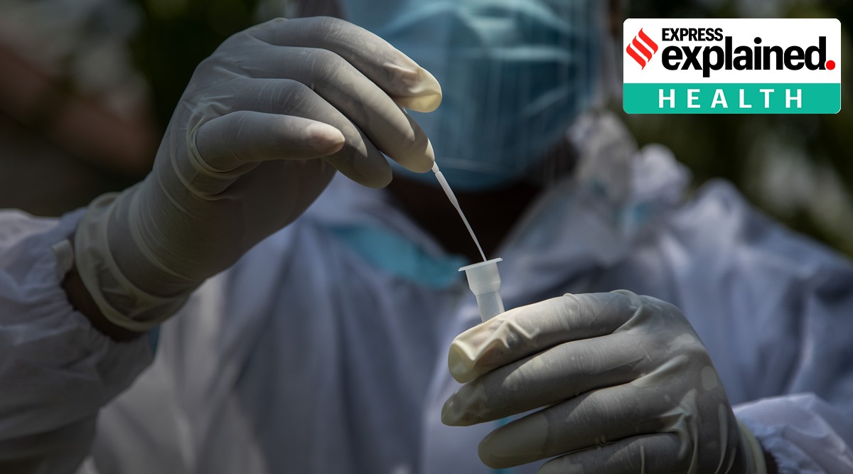 A health worker in a protective suit collects swab samples to test for Covid-19 in Assam. (AP Photo/Anupam Nath, File)