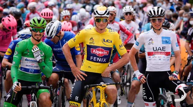 France's Julian Alaphilippe, wearing the best sprinter's green jersey, Netherland's Mathieu Van Der Poel, wearing the overall leader's yellow jersey, and Slovenia's Tadej Pogacar, wearing the best young rider's white jersey, wait for the start of the third stage of the Tour de France cycling race over 182.9 kilometers (113.65 miles) with start in Lorient and finish in Pontivy, France, Monday, June 28, 2021. (AP Photo/Daniel Cole)