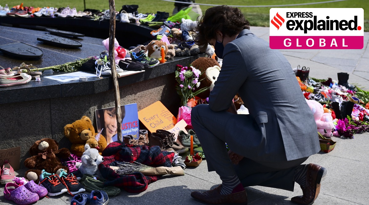 Canadian Prime Minister Justin Trudeau visits a memorial that's in recognition of discovery of children's remains at the site of a former residential school. (Sean Kilpatrick/The Canadian Press via AP, File)