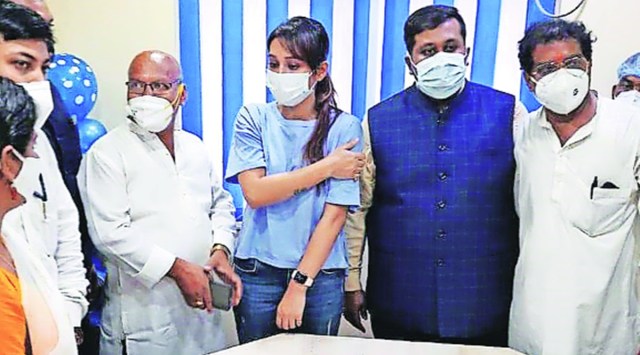 (Left) Trinamool MP Mimi Chakraborty (second from left) at a vaccination camp held by Debranjan Deb (second from right) at Kasba in Kolkata on Wednesday. (Express Photo)