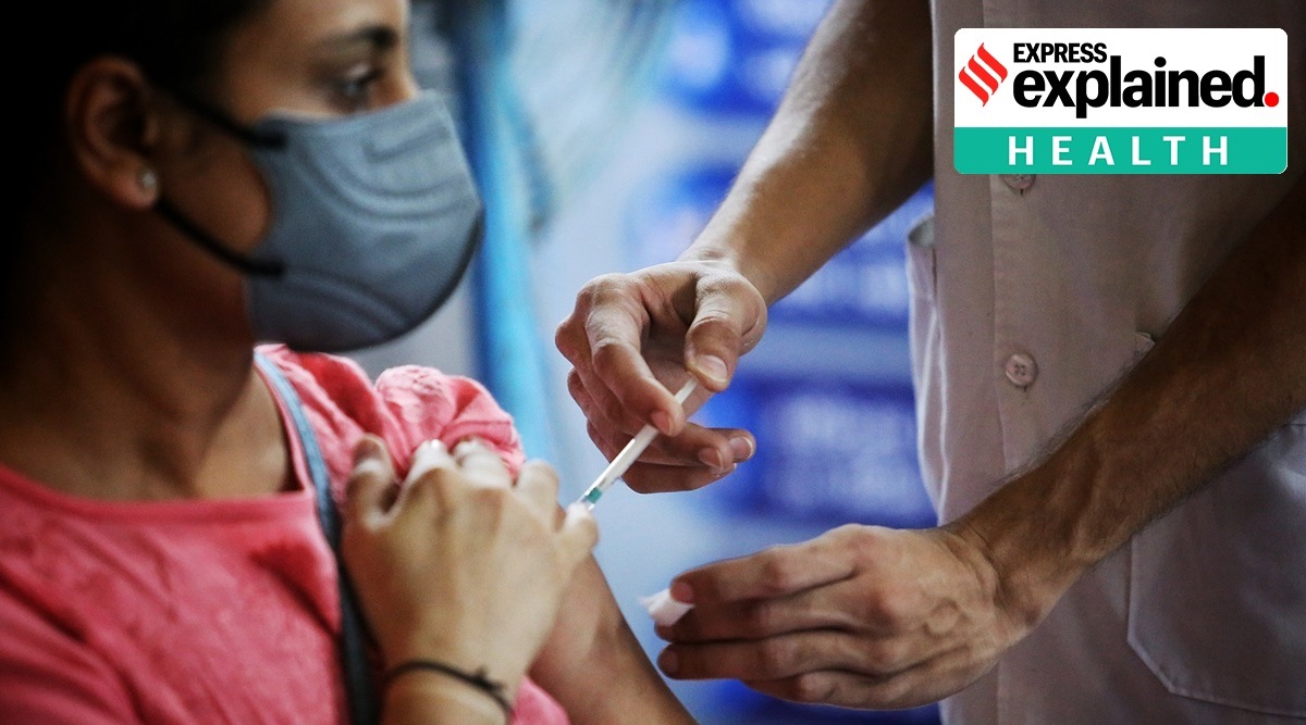 A woman receives a Covid-19 vaccine during a mega vaccination drive in Ahmedabad. (Express Photo: Nirmal Harindran)
