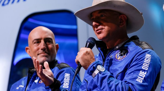 Billionaire American businessman Jeff Bezos speaks with his brother Mark at a post-launch press conference after they flew on Blue Origin's inaugural flight to the edge of space, in the nearby town of Van Horn, Texas, US. (Reuters)