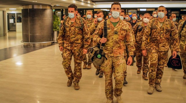 Italian Army soldiers of the last Italian troops withdrawing from Afghanistan walk in the airport in Pisa, Italy (AP)
