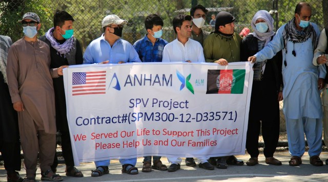 Former workers who had been employed with US troops at the Bagram airbase hold placards during a demonstration against the US government in Kabul, Afghanistan. (Photo: Reuters)