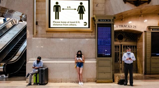 Socially-distanced commuters wear face masks at Grand Central Station in Manhattan on Tuesday, July 27, 2021. (Brittainy Newman/The New York Times)