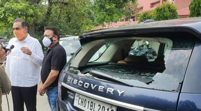 Sanjay Tandon (left) and mayor Ravi Kant Sharma near the damaged Range Rover of Sanjay Tandon. (Express)