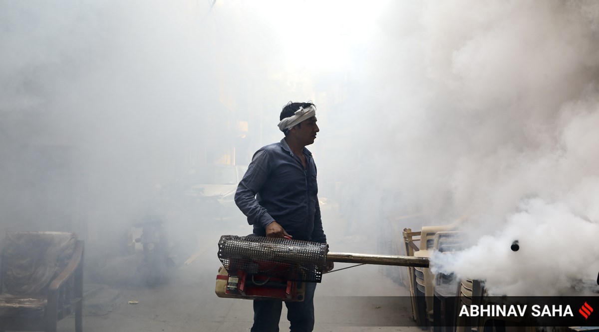 A health worker fumigates a residential area to prevent the spread of mosquito-borne diseases. (Express Photo: Abhinav Saha, File)