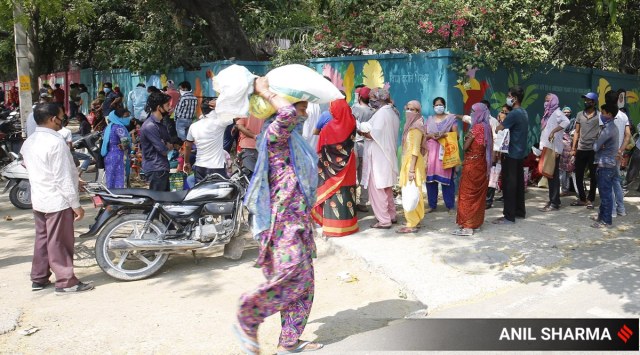 People wait in queue for ration in New Delhi. (Express Photo: Anil Sharma, File)