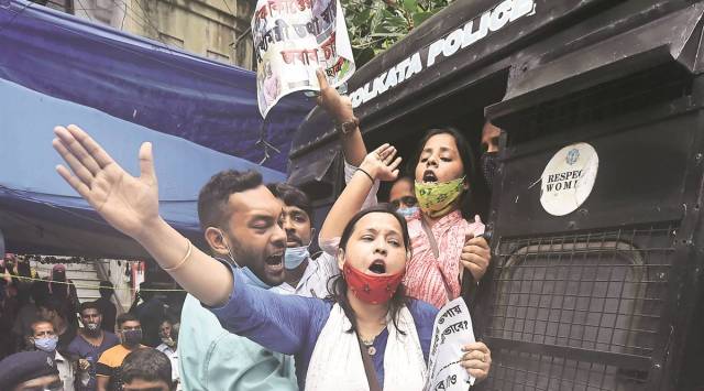 The police detain ‘Chhatra Parishad ‘ members at a protest  against unauthorised Covid-19 vaccination camps, outside the state Legislative Assembly in Kolkata on Friday. 
(Express photo by Partha Paul)