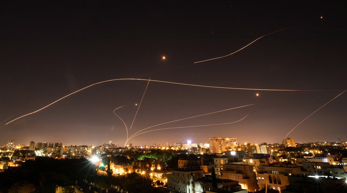 Israel's Iron Dome missile defense system lights up the sky over Tel Aviv as it tries to intercept rockets fired from Gaza on May 16, 2021. (Corinna Kern/The New York Times)