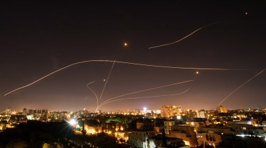 Israel's Iron Dome missile defense system lights up the sky over Tel Aviv as it tries to intercept rockets fired from Gaza on May 16, 2021. (Corinna Kern/The New York Times)
