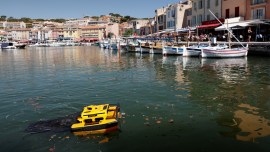 The Jellyfish, a little catamaran operated by remote control, which is capable to clean water by collecting rubbish on the water's surface is seen at work in the port of Cassis, southern France.